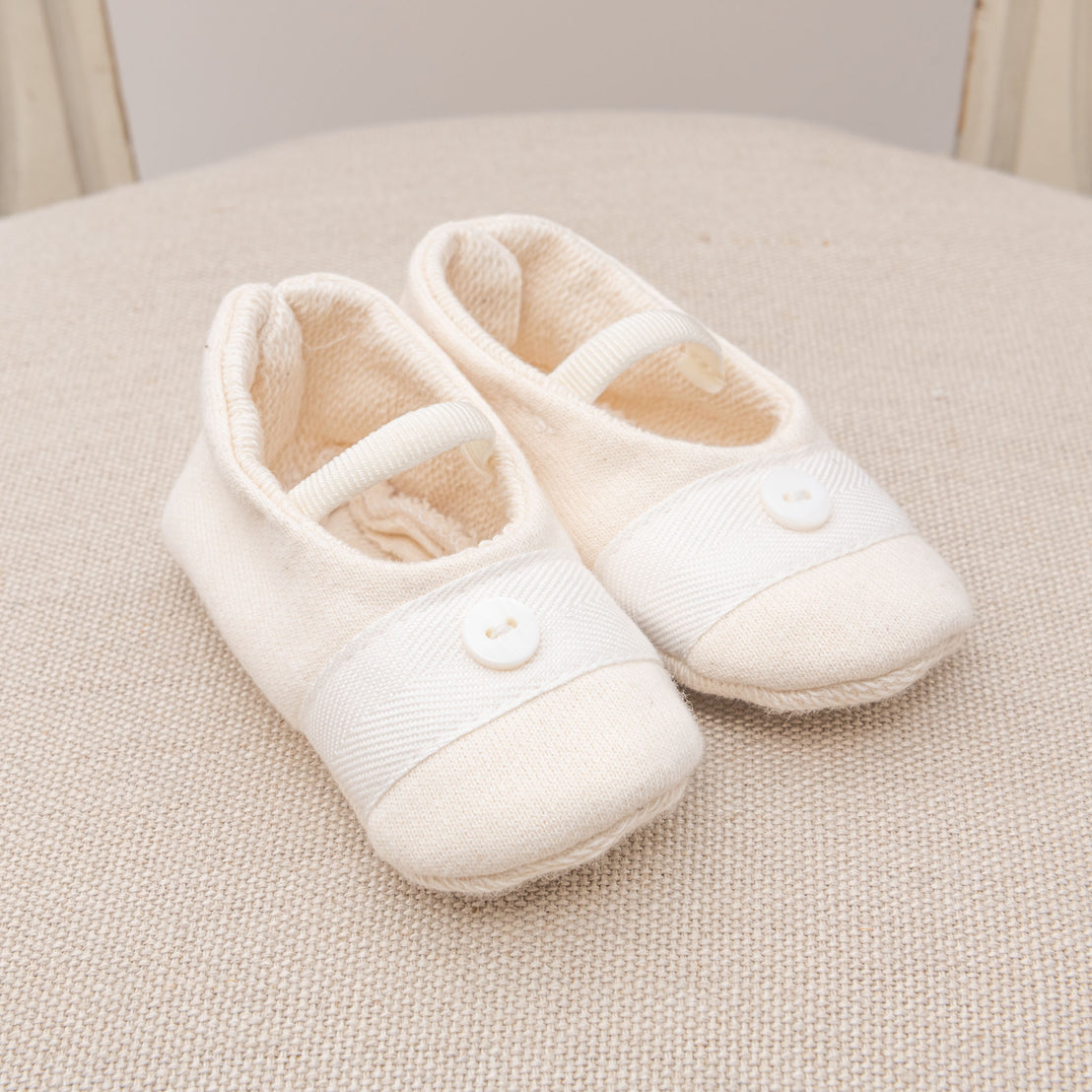 Flat lay photo of the Braden Booties made from ivory french terry cotton
