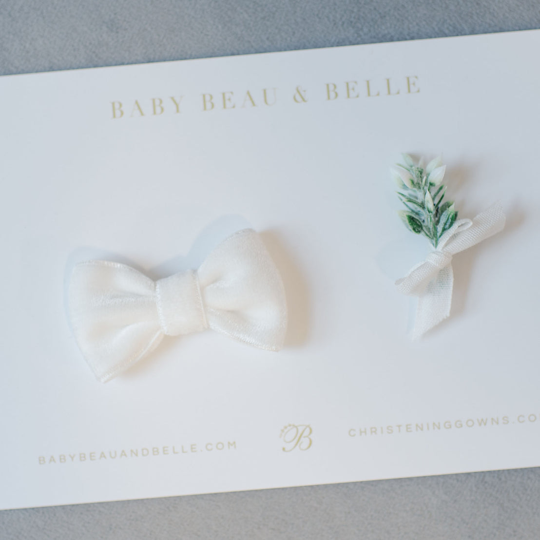 Flat lay photo of the White Velvet Bow Tie and Boutonniere that is attached to a card
