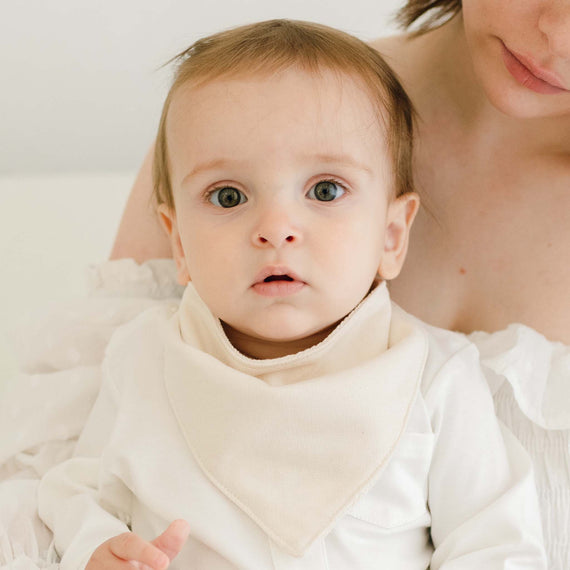 Baby boy wearing the Braden Bib made from natural french terry cotton