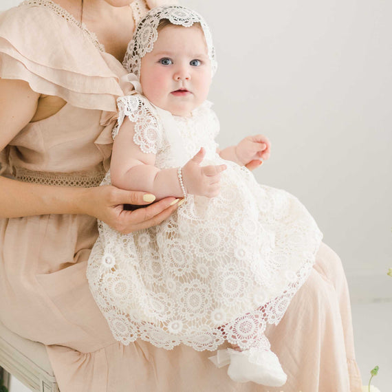 Baby girl in her lace Blessing Dress