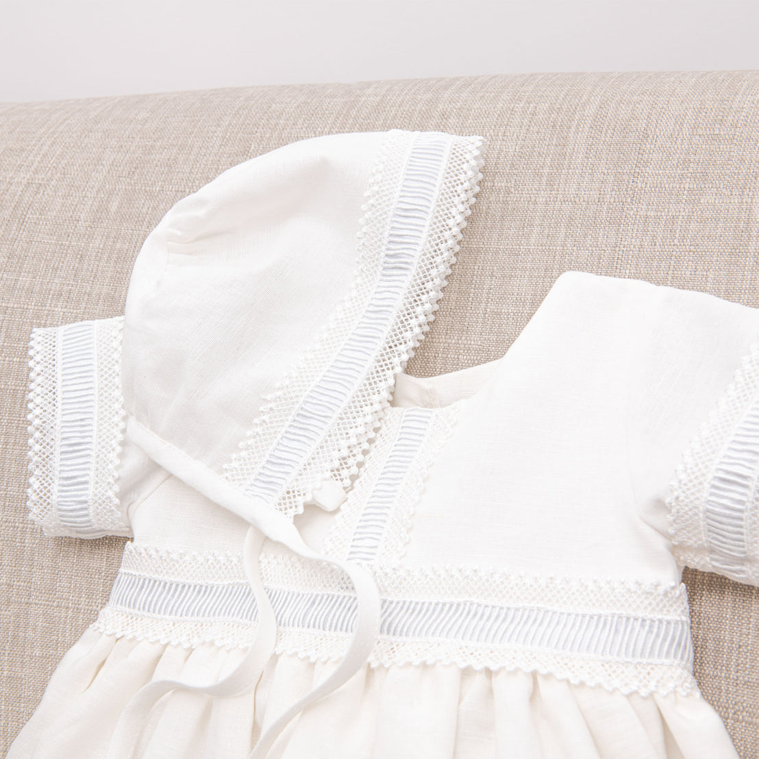 Photograph of the boys bonnet and baptism gown.