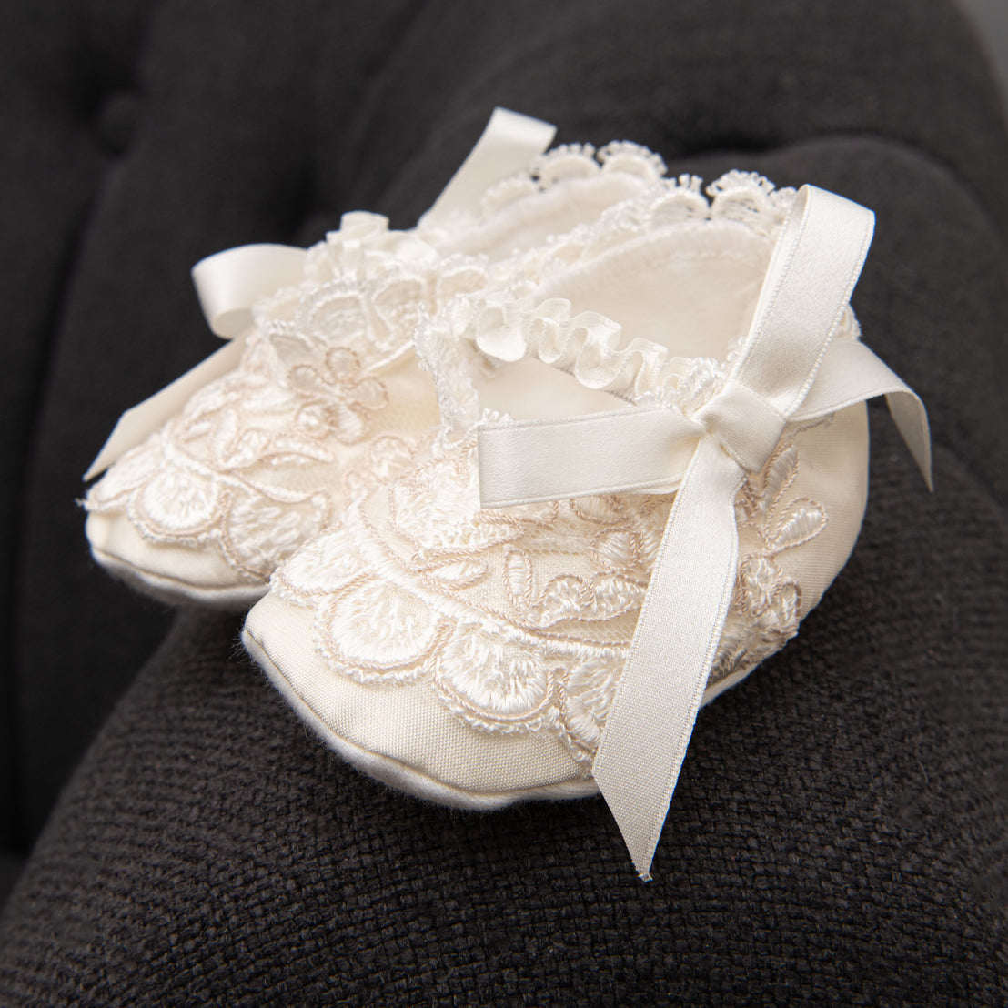 Product photo of detail on Penelope Christening Booties: Elegant Lace and bowtie. 