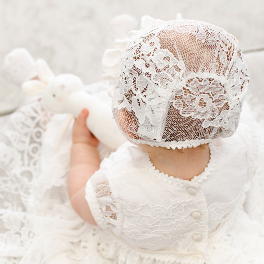 Back detail of the Victoria Lace Bonnet showcasing the ivory floral lace.