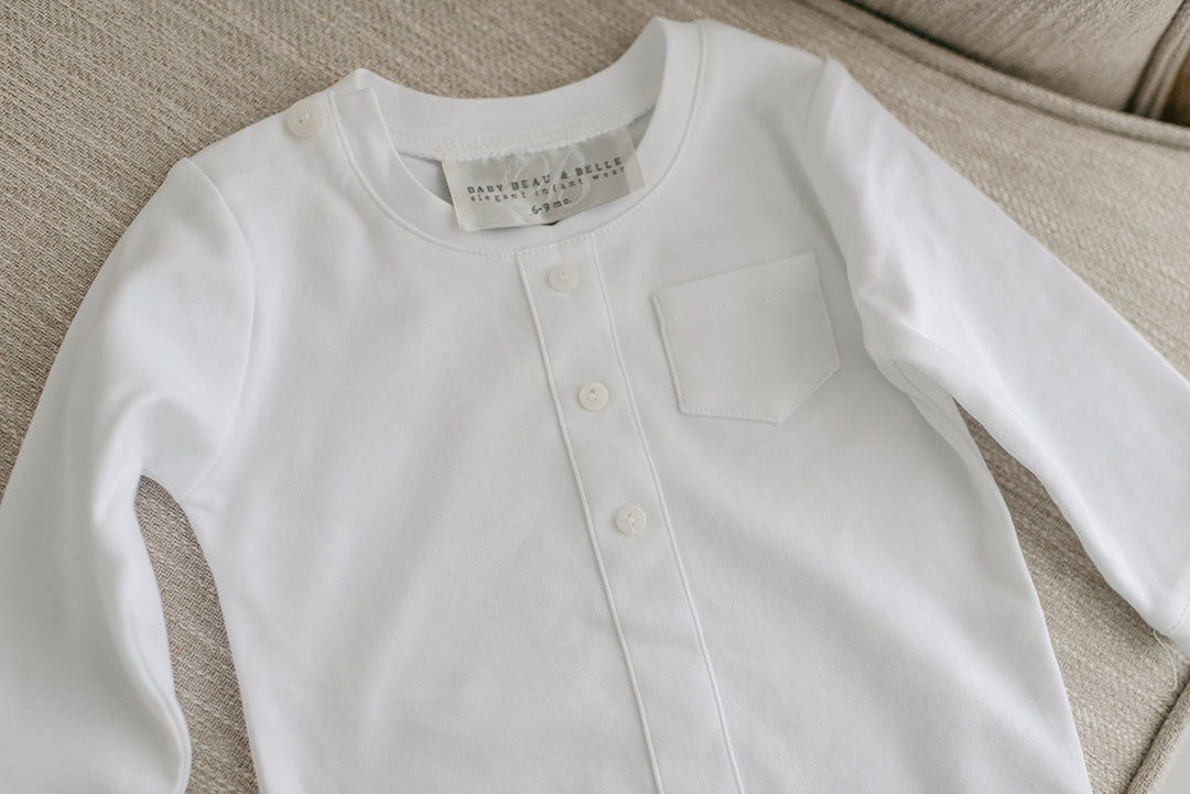 Flat lay photo of the white onesie soft long sleeved shirt