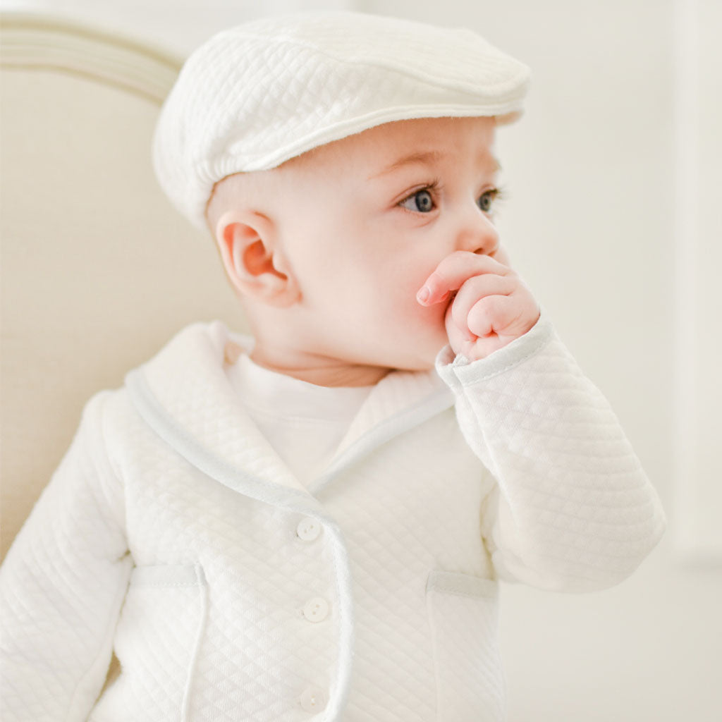 Baby boy wearing the Harrison 3-Piece Pants Suit made with a plush white quilt and light blue trim