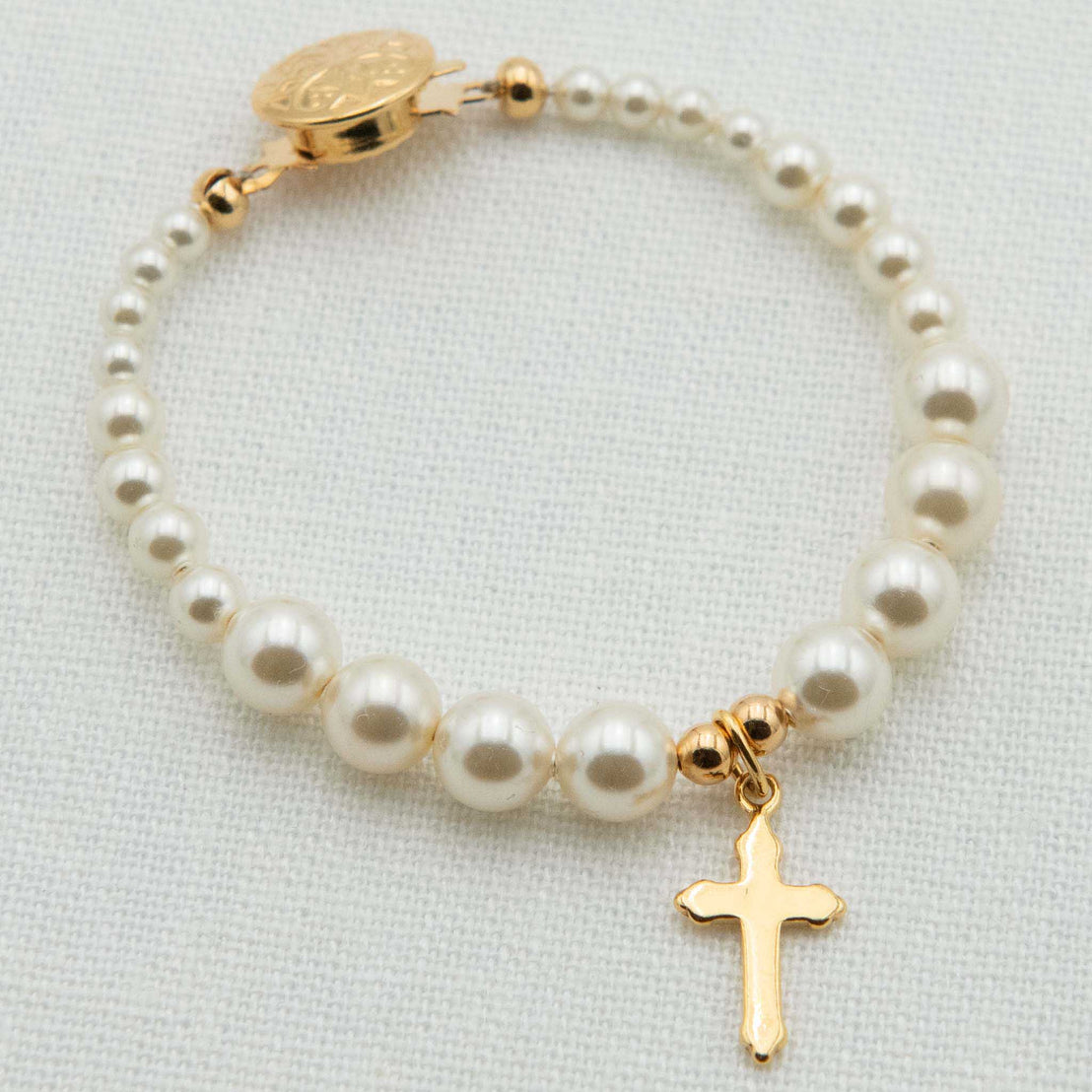 Close detail of Cream Luster Pearl Bracelet with Gold Cross