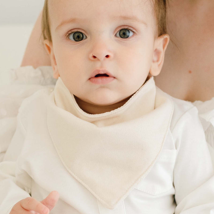 Baby boy wearing the Braden Bib made from natural french terry cotton