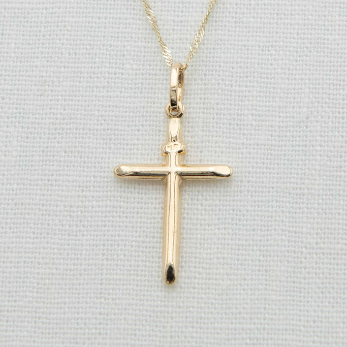 Round bar cross charm with INRI notation on chain
