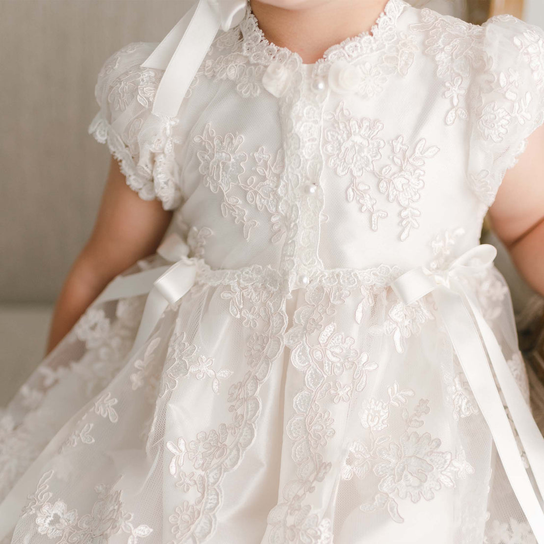 Close up of bodice of the Penelope Christening Gown & Bonnet. 