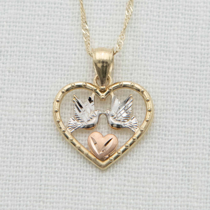Gold heart with white gold doves and rose gold heart detail on chain