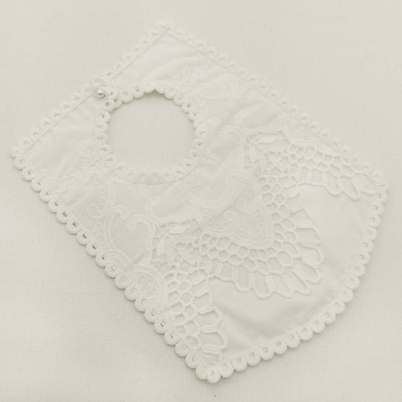 Off-white lace bib on a light gray background
