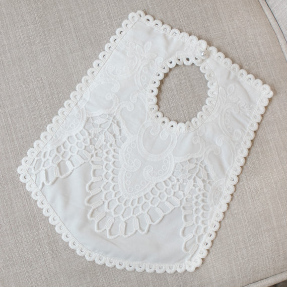 White lace bib on a beige fabric background