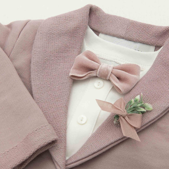Flat lay photo of the Ezra Mauve Jacket, featuring the velvet bowtie and boutonniere