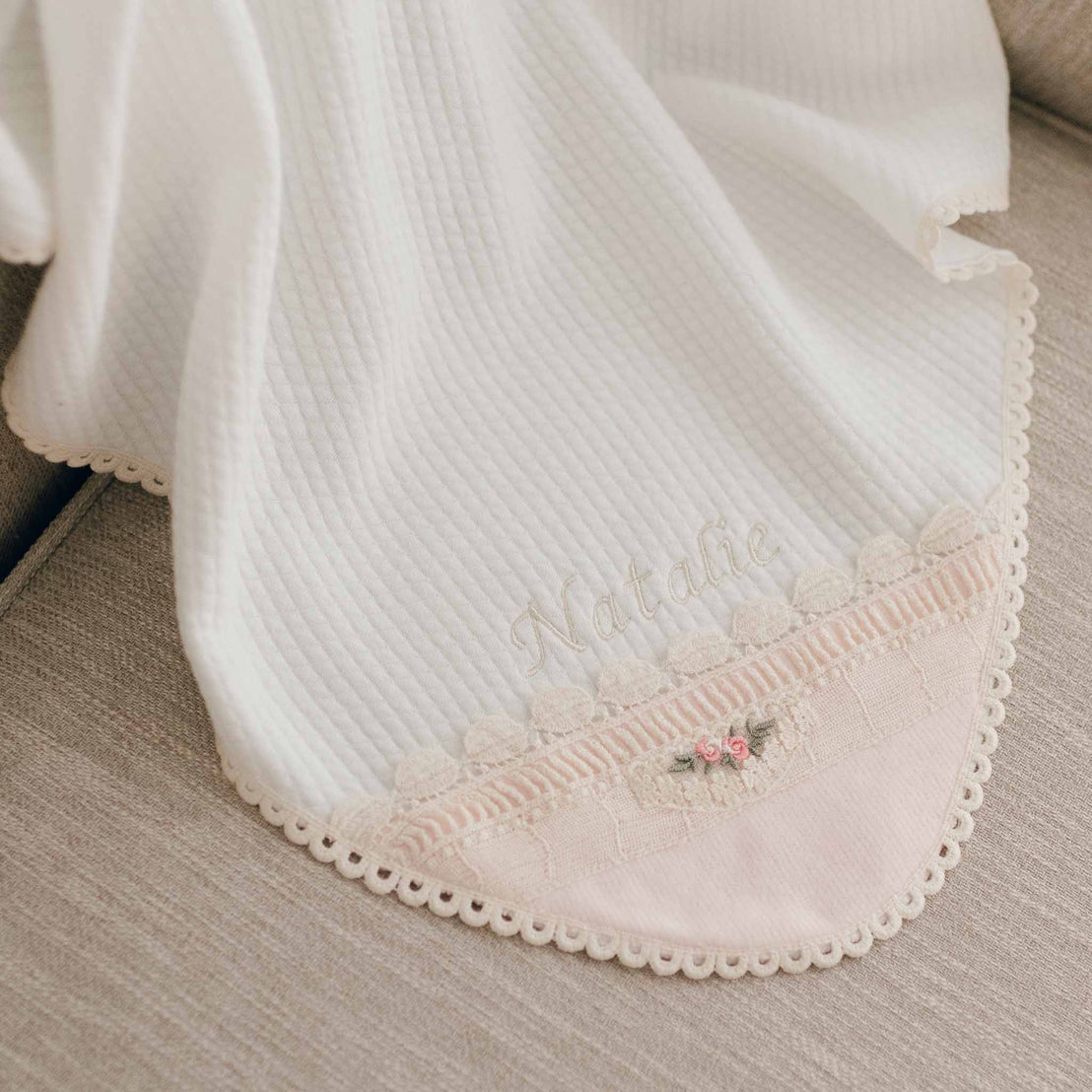 Natalie embroidered blanket flat lay