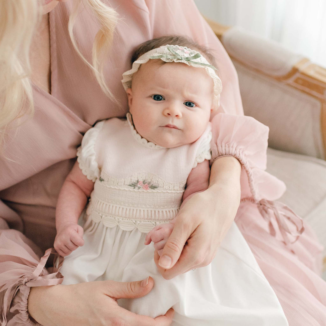 Mother holding her daughter who is wearing the Natalie Layette and Headband