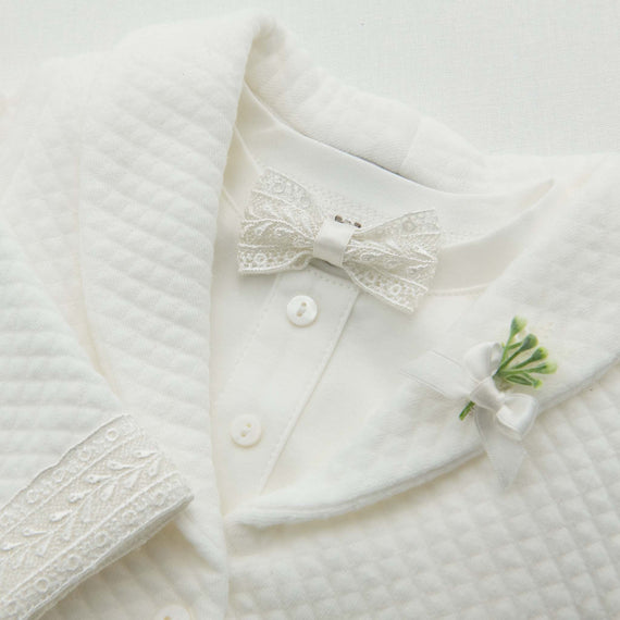 Ivory lace and silk ribbon bow tie on ivory quilt baby suit jacket with matching lace trim