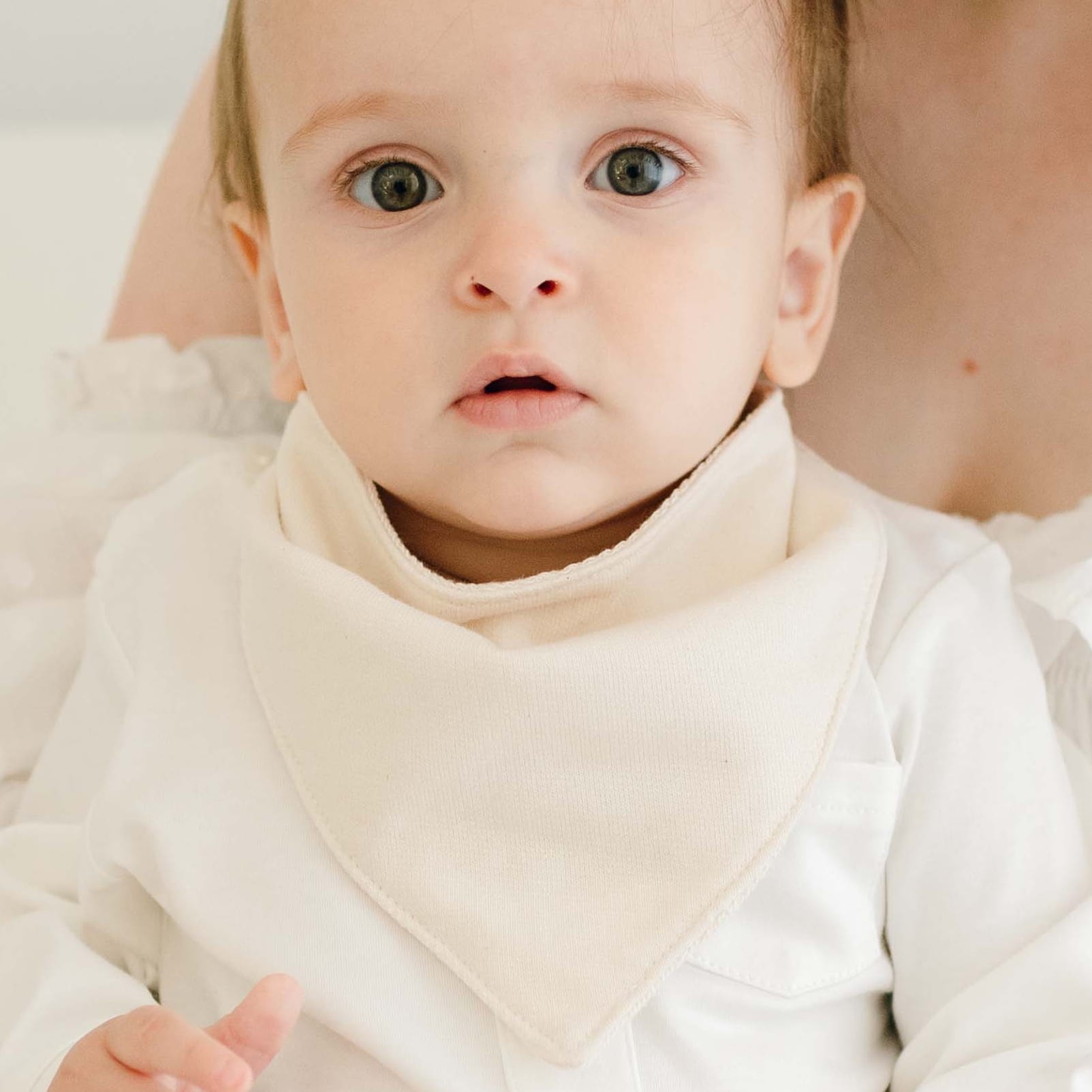 Baby boy wearing the Braden Bib made from natural french terry cotton