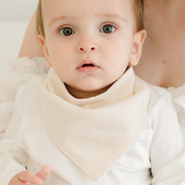 Baby boy wearing the Braden Bib made from natural french terry cotton