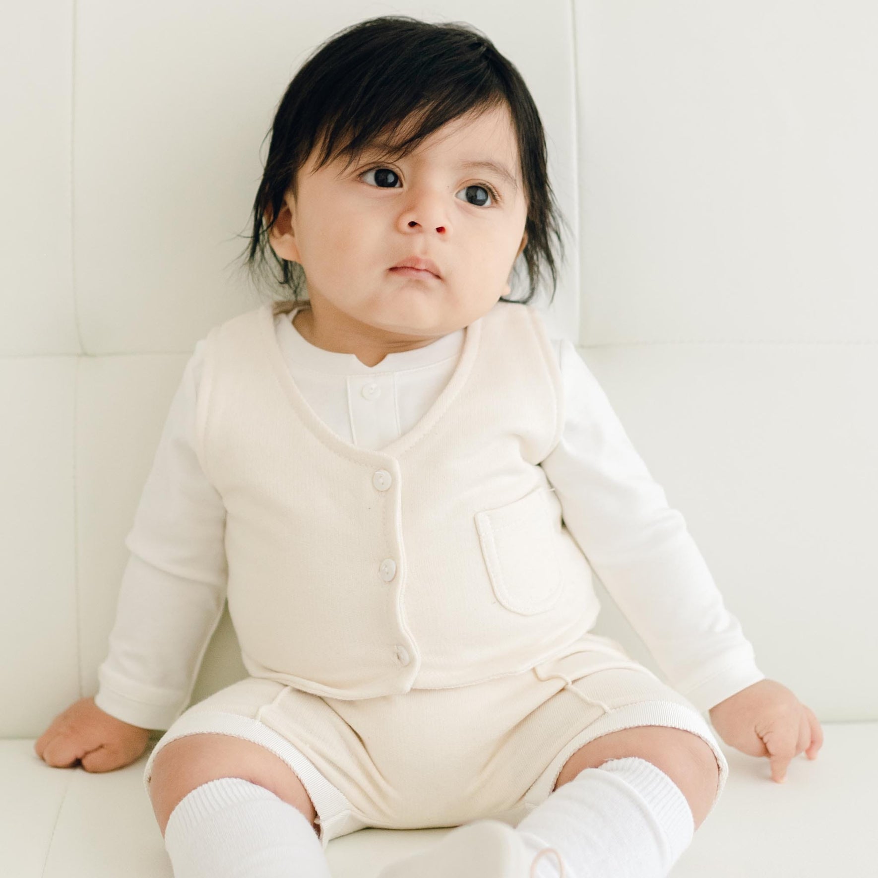 Baby boy wearing the Braden Vest Shorts Suit made of ivory French Terry