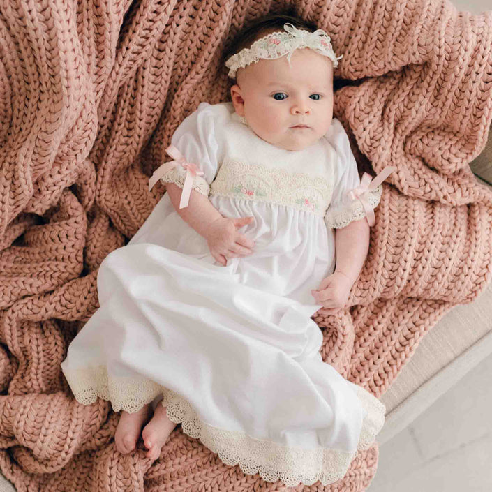 Chloe newborn layette and headband on baby