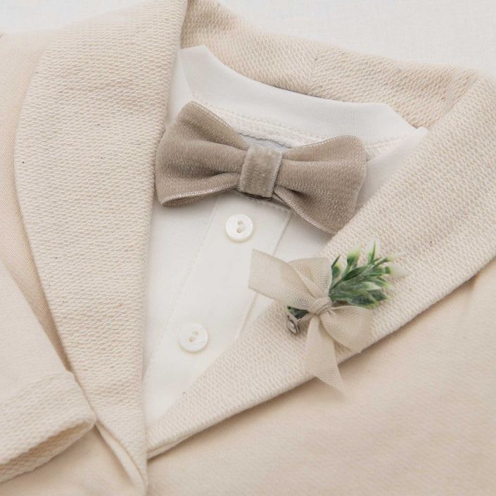 Flat lay photo of the Ezra Tan Velvet Bow Tie and Boutonniere