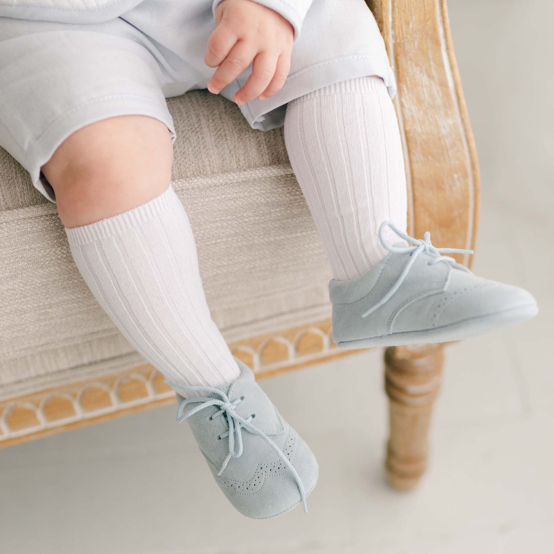 Detailed view of the blue suede shoes and white socks, complementing the Harrison Christening Shorts Suit for an elegant finish.