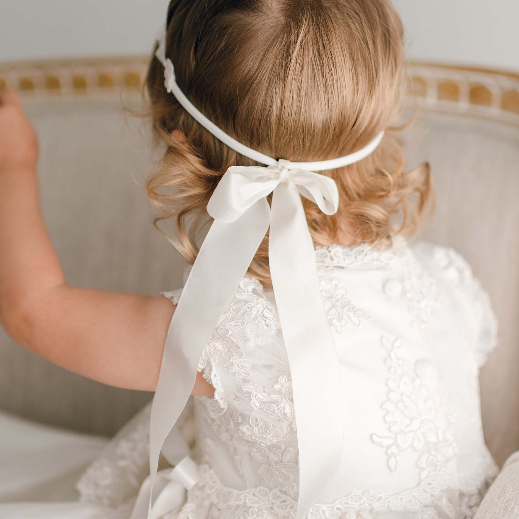 Detail of back of our floral lace headband. Featuring a large lace bow tied at back.