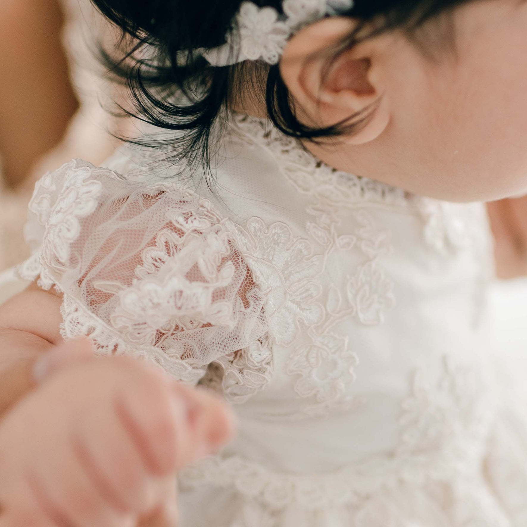 Sleeve detail of baby girl fancy dress made with lace and silk
