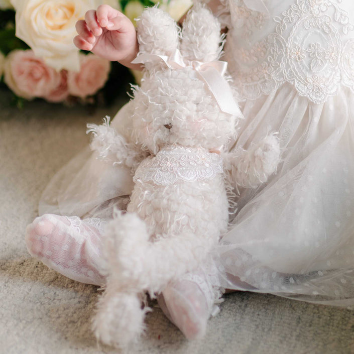 A closer view of the Sophia Bunny, featuring its soft fur, embroidered face, and delicate lace details.
