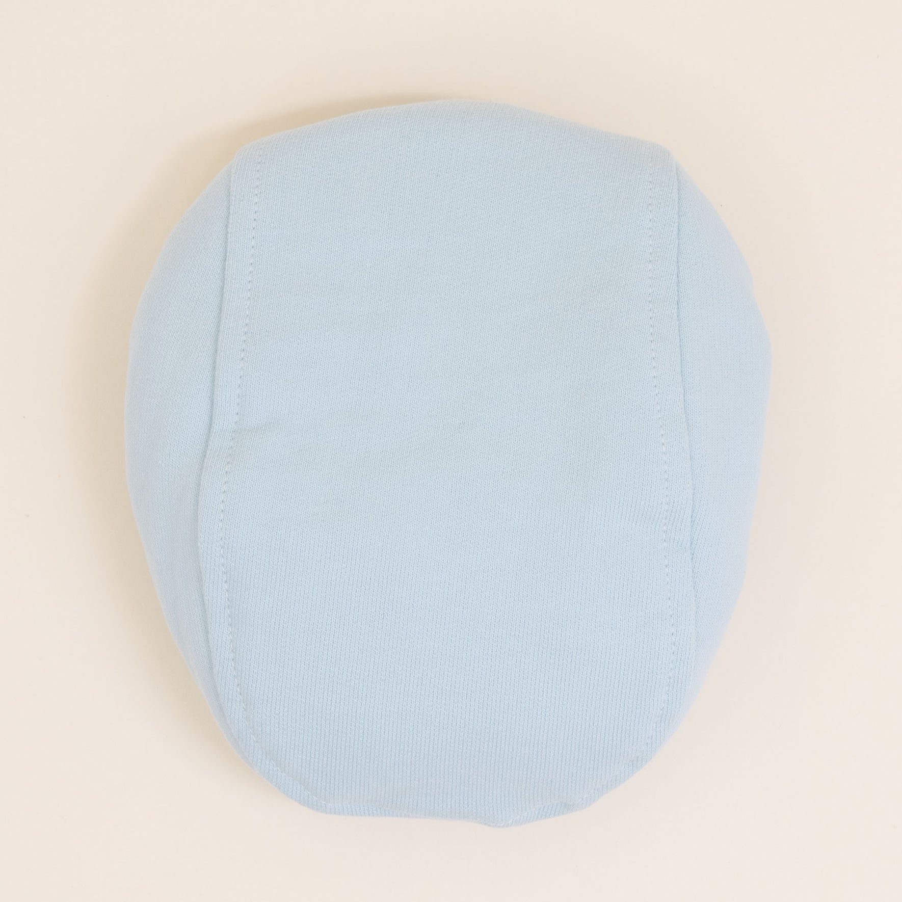 Flat lay photo of the Theodore Newsboy Caps in blue.
