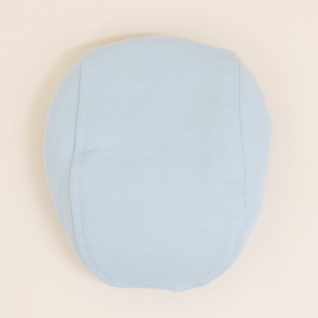 Flat lay photo of the Theodore Newsboy Caps in blue.