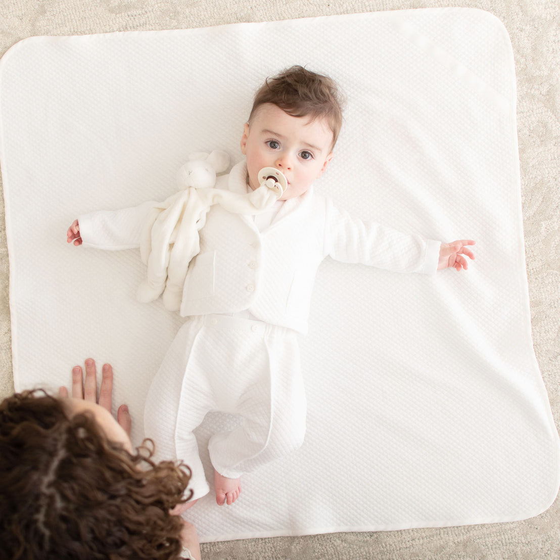 Photo of a newborn baby boy laying on the Elijah Personalized Blanket