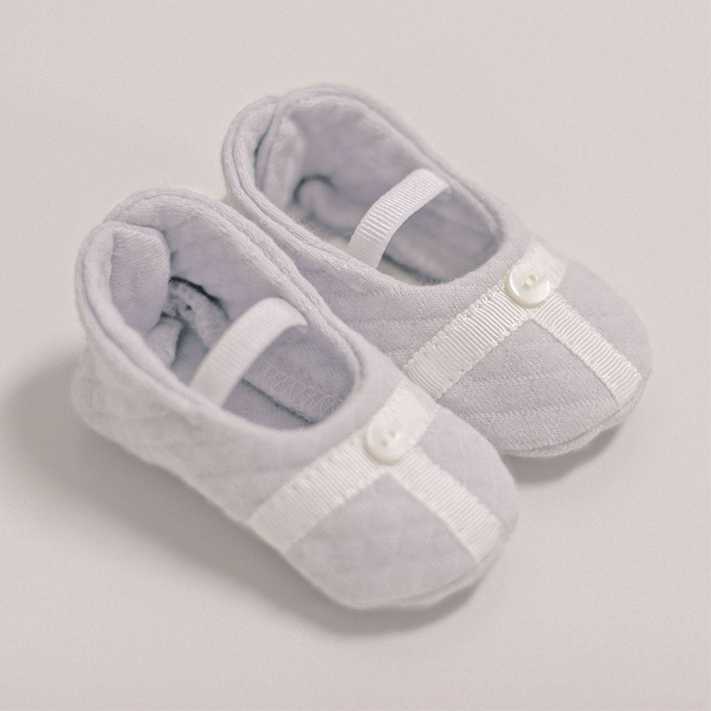 Flat lay images of the Grayson grey trim booties. 