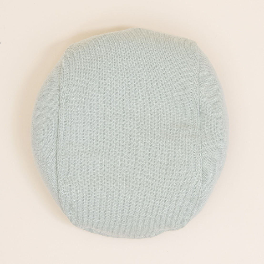 Flat lay photo of the Theodore Newsboy Caps in green.