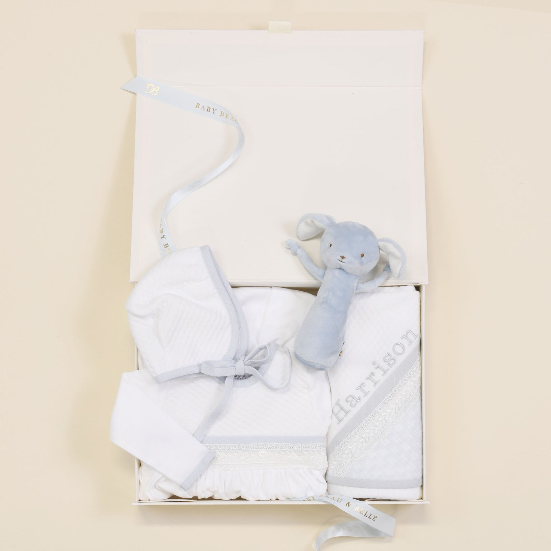 Photo of the Harrison Newborn Gift Set, which includes the Layette Gown, Bonnet (or Knot Cap), Rattle, Blanket, and Gift Box