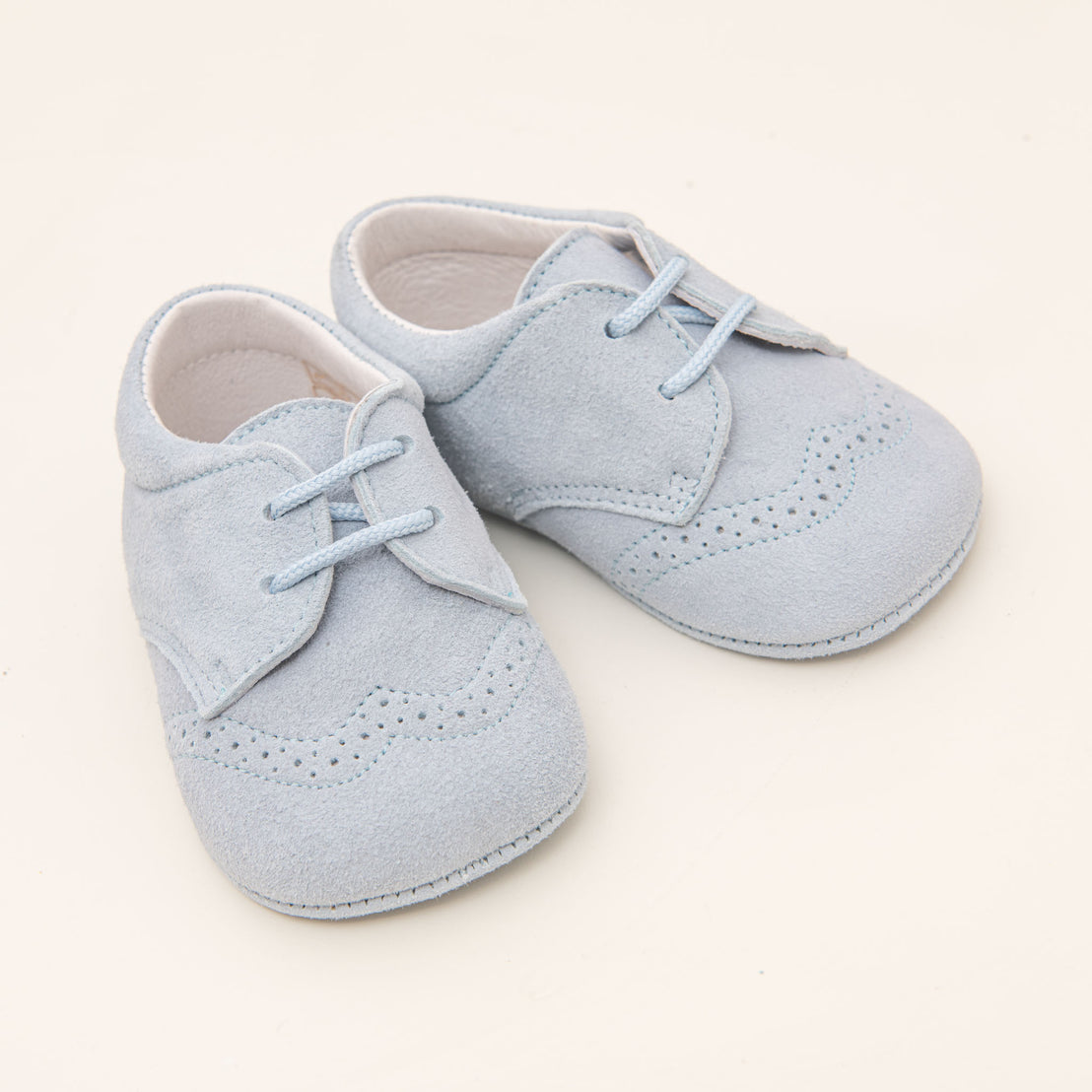 Flat lay photo of the dove sky blue Asher Suede Shoes.