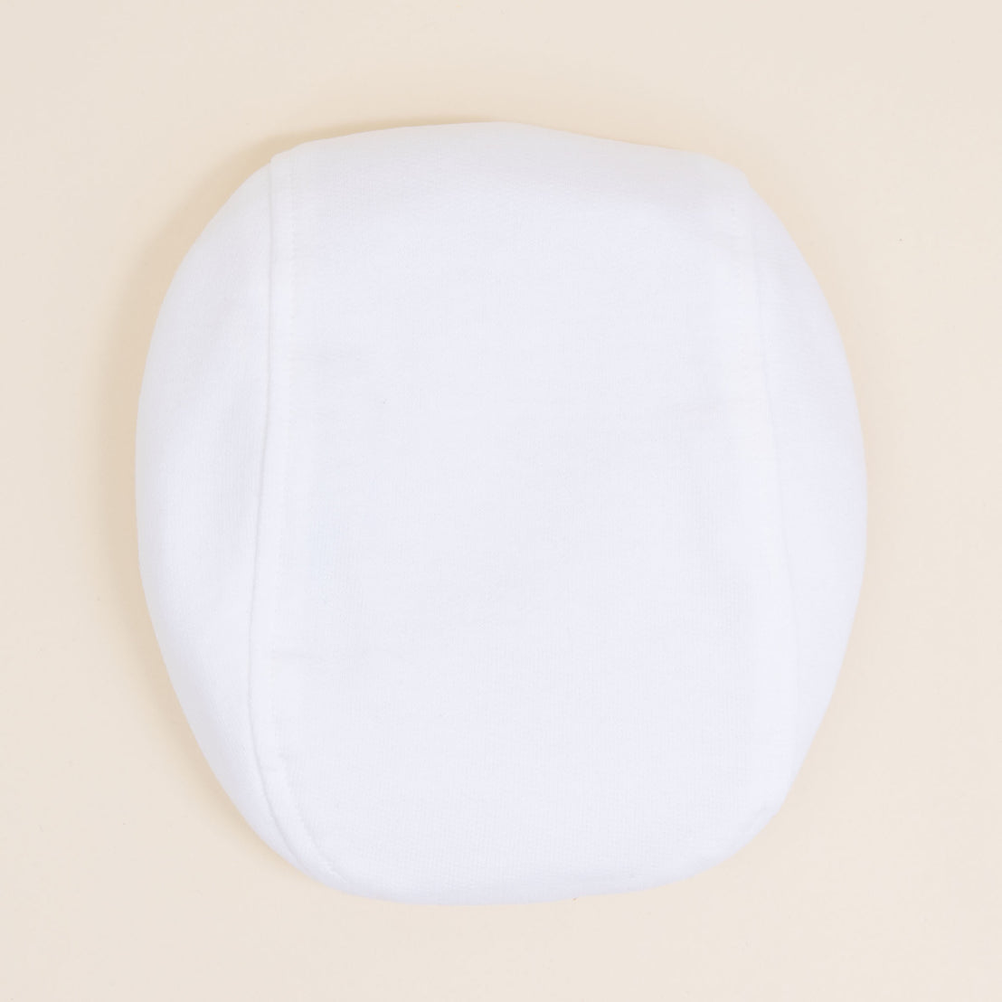 Flat lay photo of the Theodore Newsboy Caps in white.