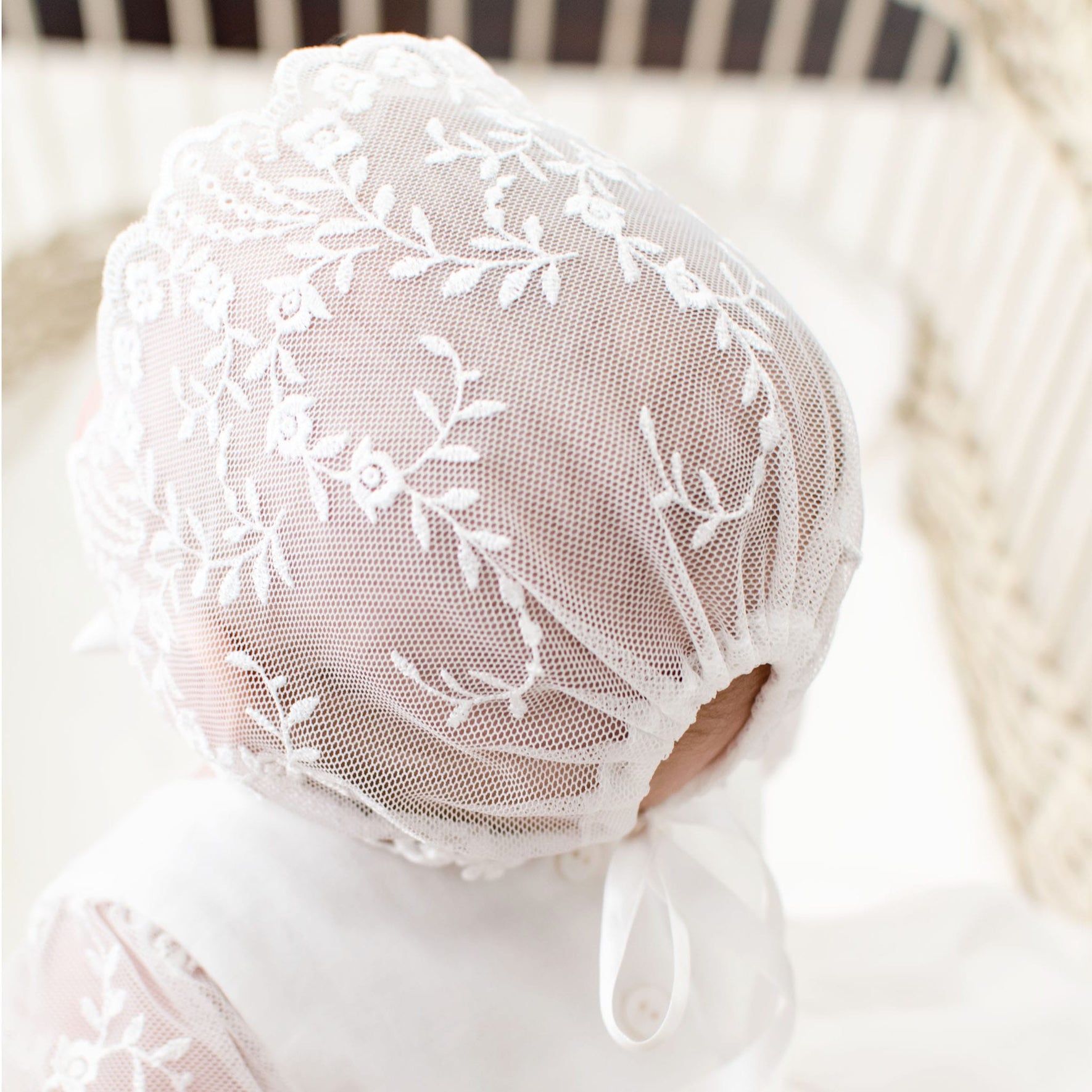 Details of the backside of the Ella lace baptism bonnet.