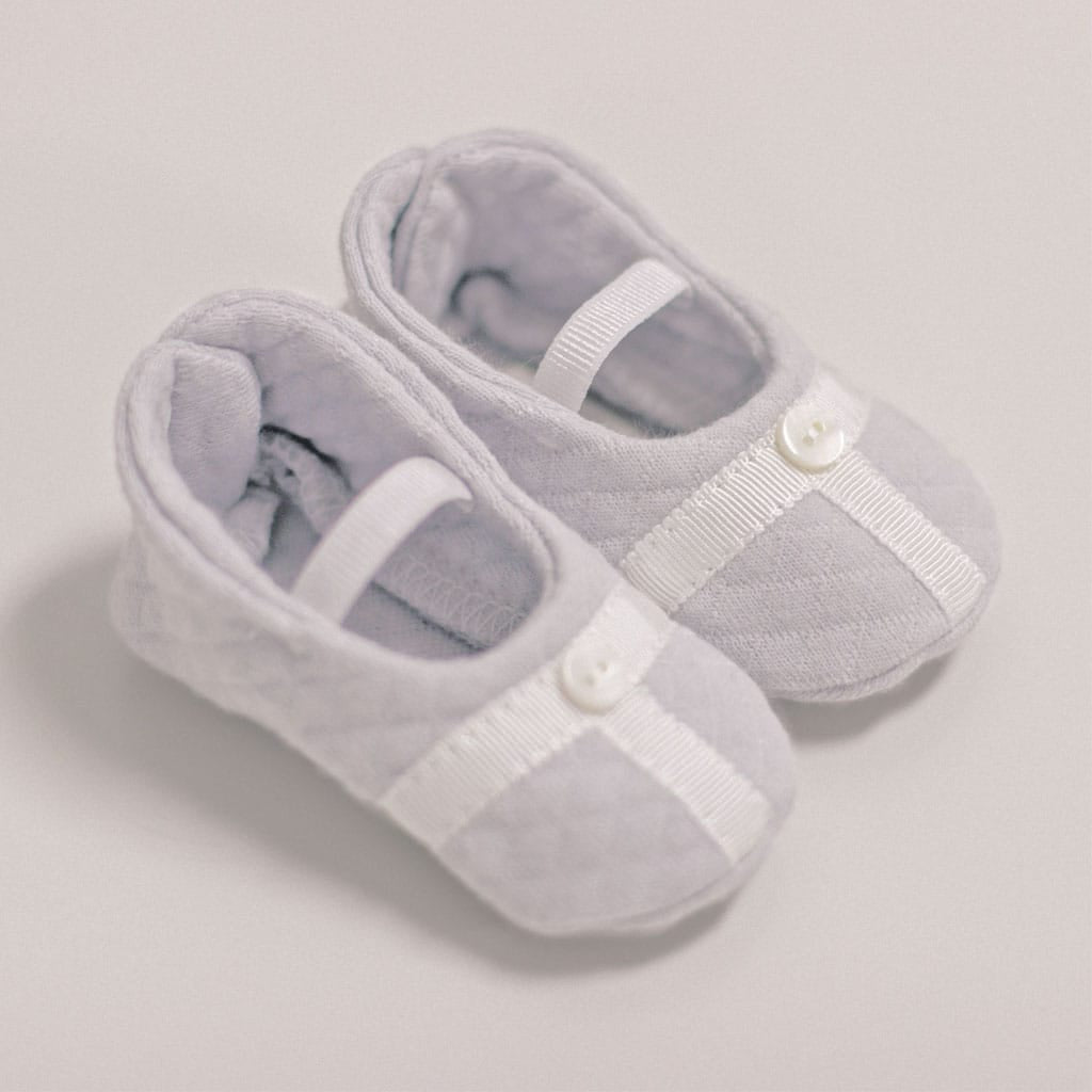 Flat lay images of the Grayson grey trim booties. 