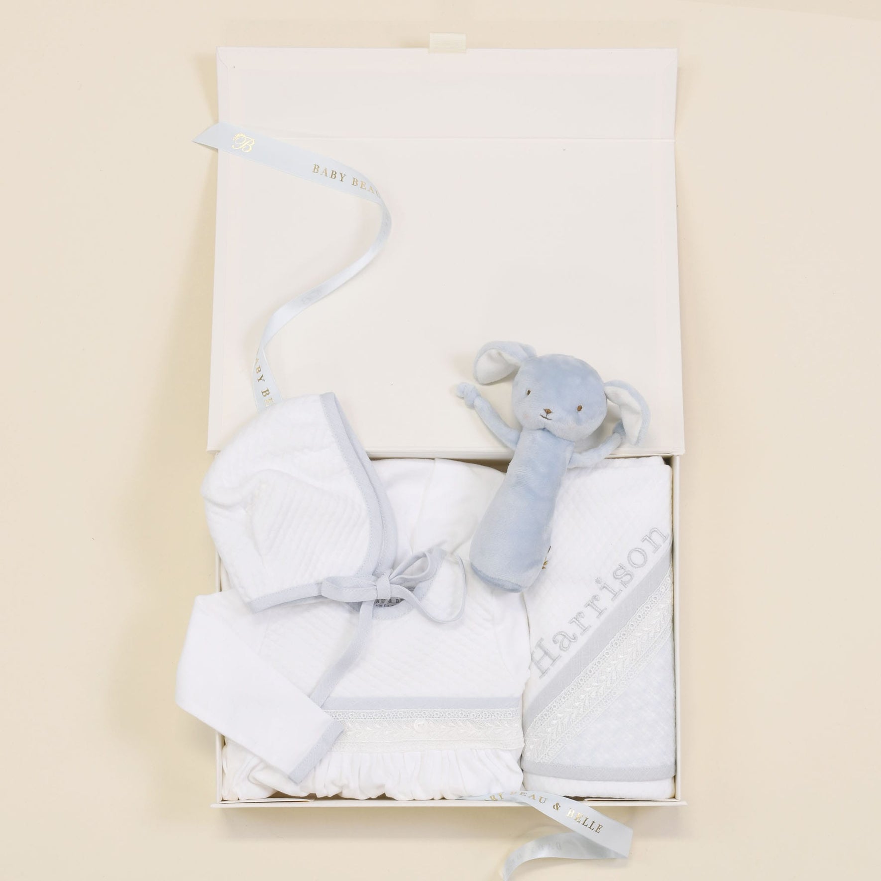 Photo of the Harrison Newborn Gift Set, which includes the Layette Gown, Bonnet (or Knot Cap), Rattle, Blanket, and Gift Box