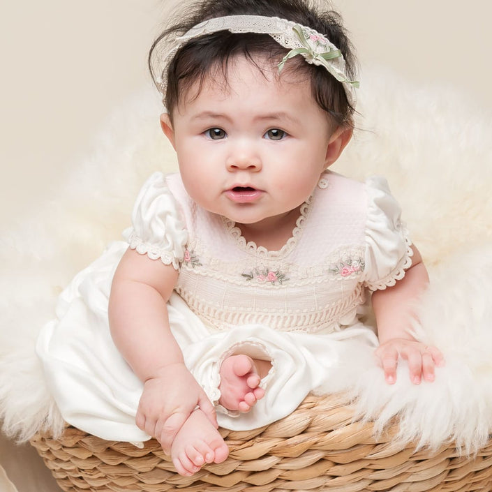 Baby sitting in Natalie gown, bodice lace detail