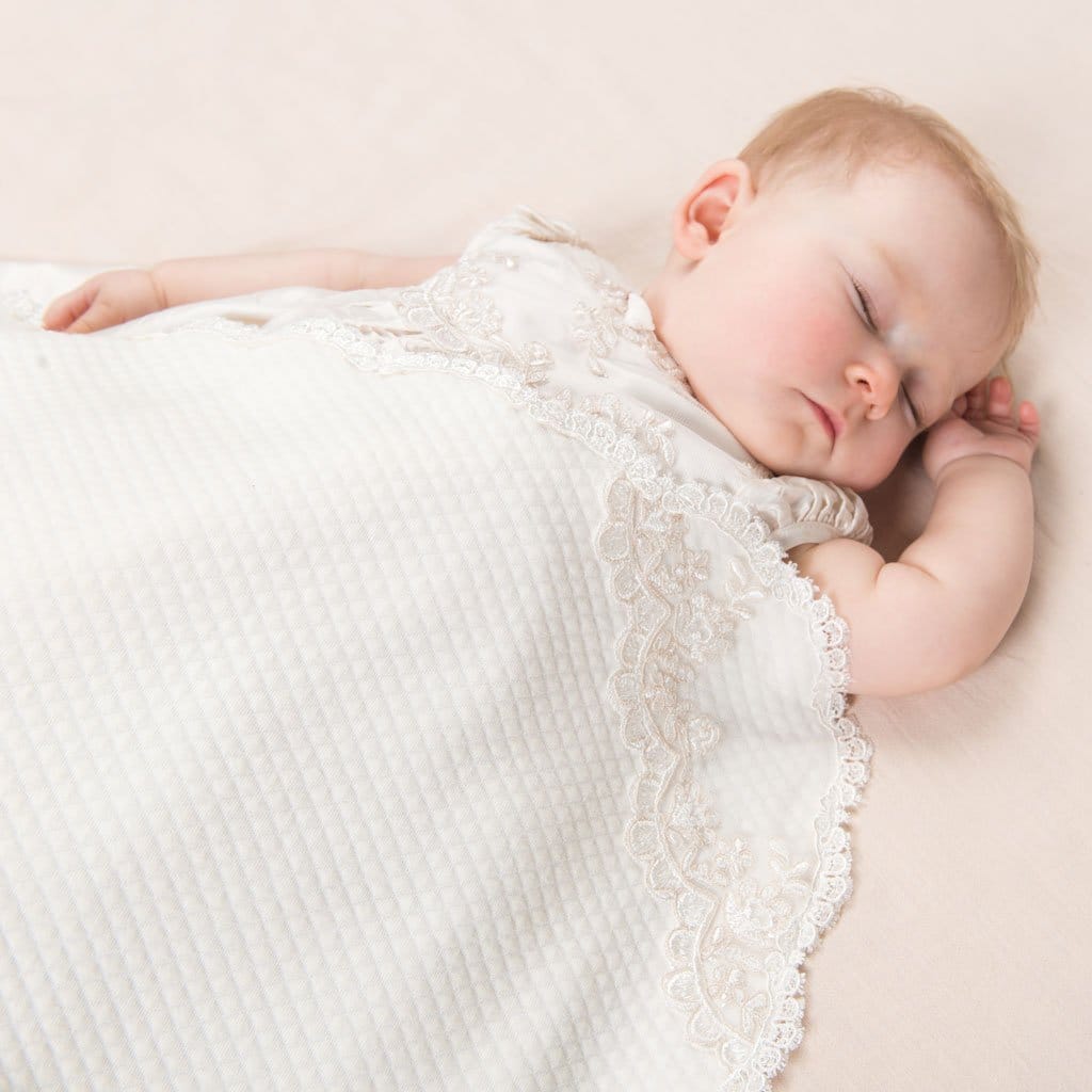 Baby girl sleeping in the Penelope Receiving Blanket - Girls Blanket for baptism.