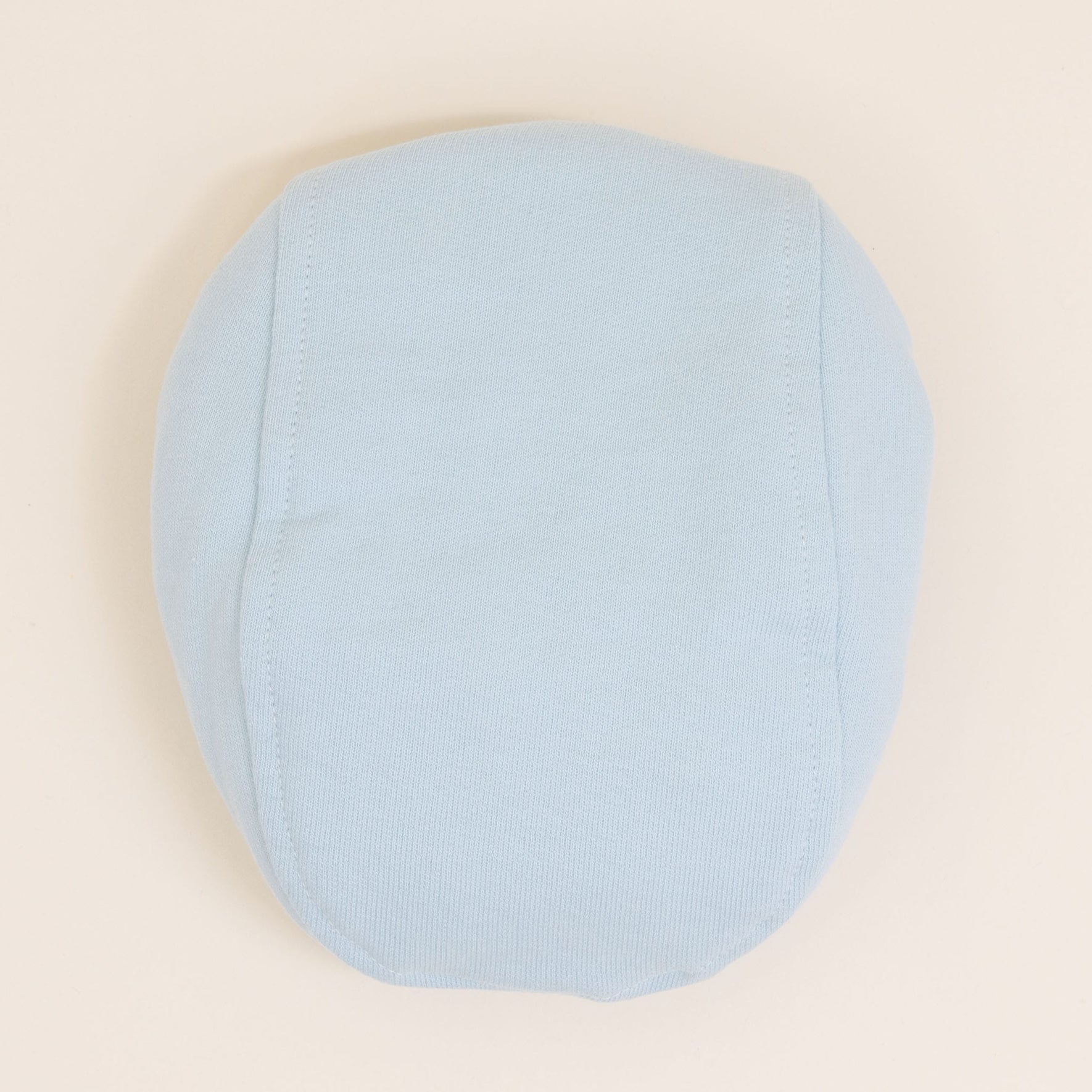 Flat lay photo of the Theodore Newsboy Caps in blue.