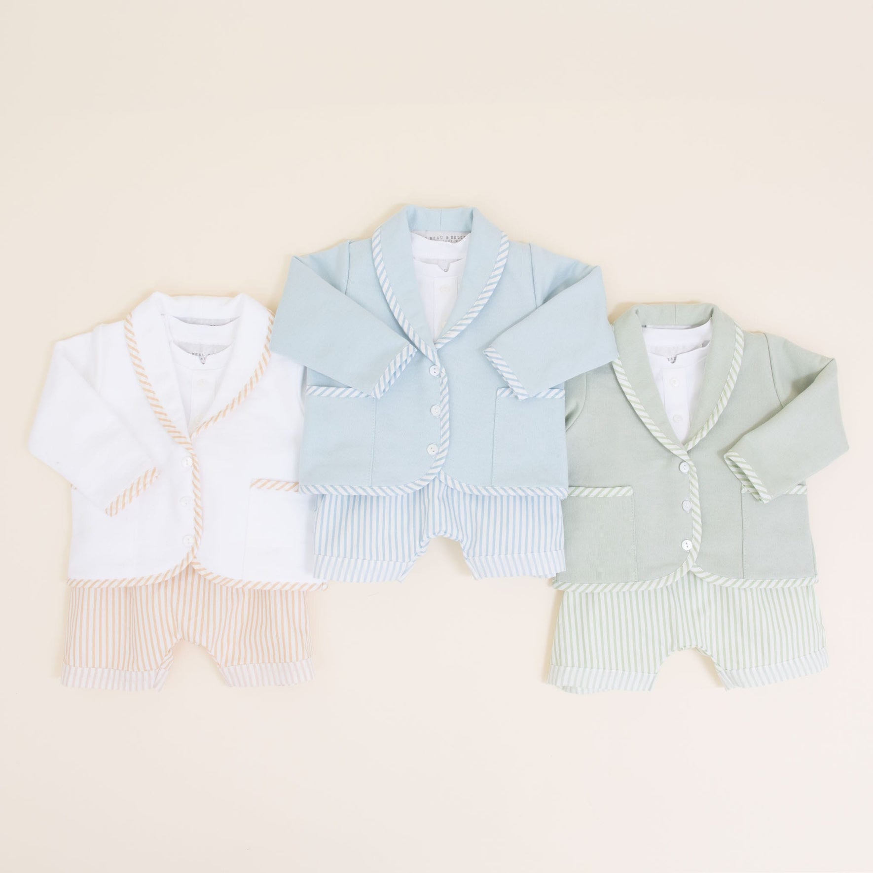 Flat lay photo comparing the three different colors of the Theodore Shorts Suit, including tan, blue, and green.