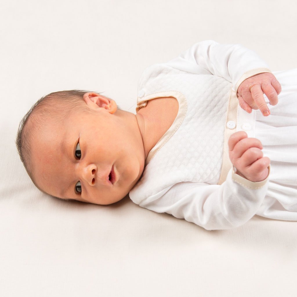 Liam Cotton Close up detail of newborn baby wearing the Liam Cotton Newborn Gown